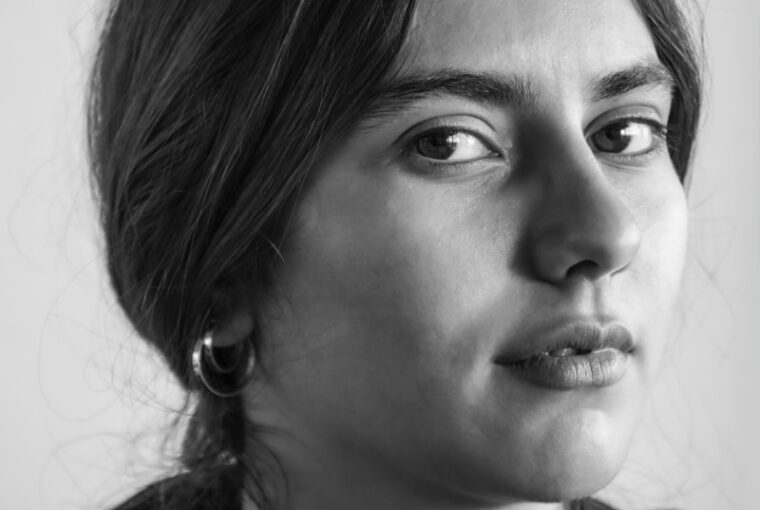 grayscale photo of woman in black shirt